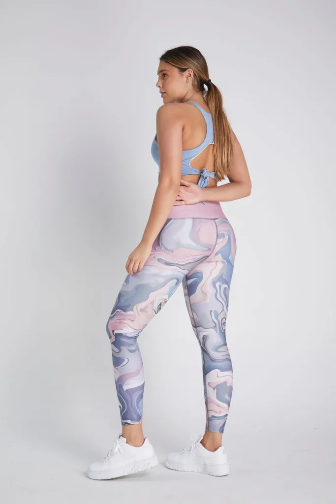 Woman in Marble Pattern Leggings and Sports Bra in Women's Activewear Clothing